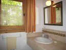 The first floor bathroom with large shower, wash basin and washing machine